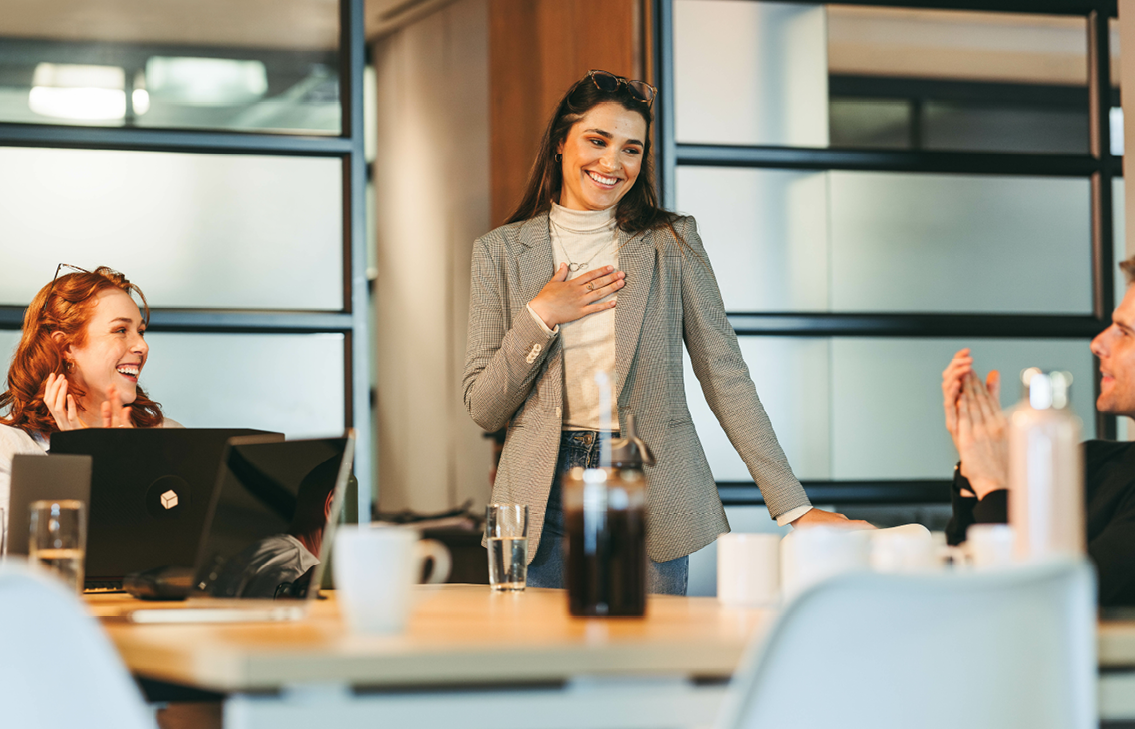 Business Woman Standing Hand on Chest