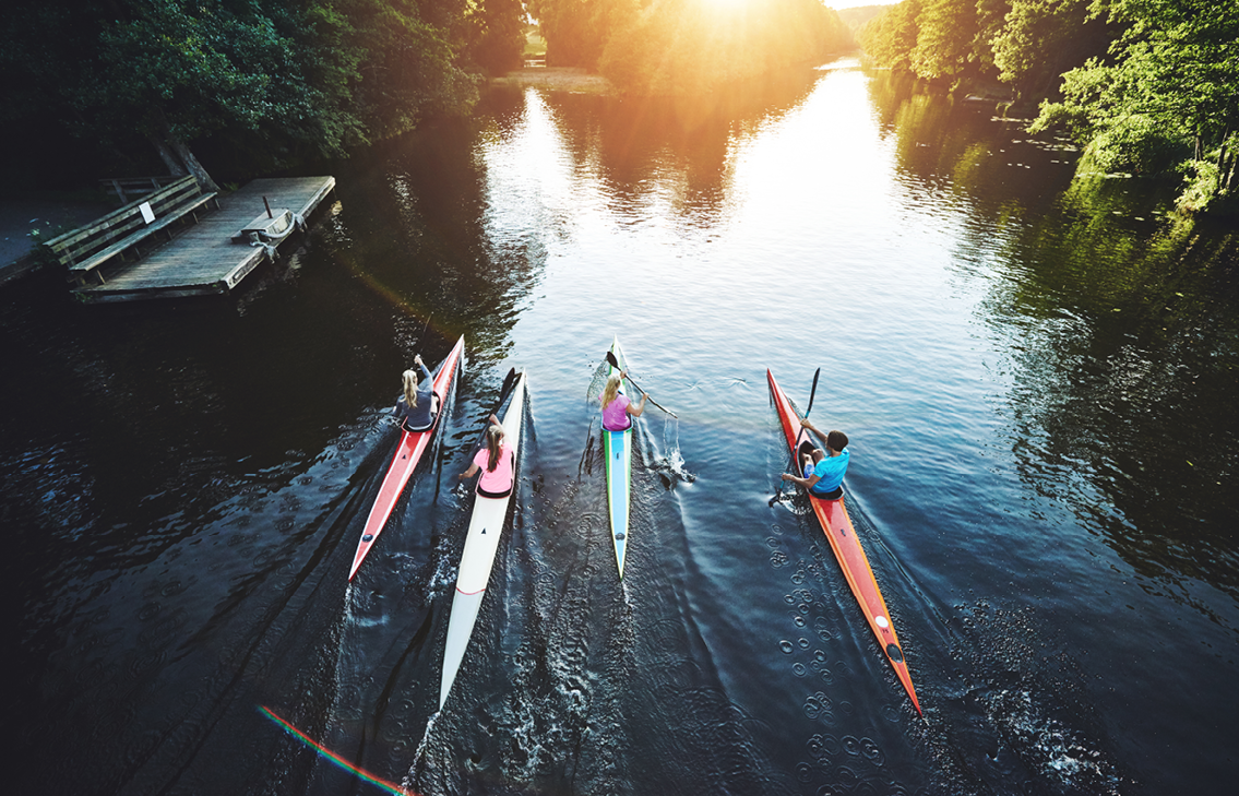 Four Kayakers on Water